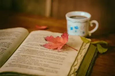 Opened book and a cup of coffee
